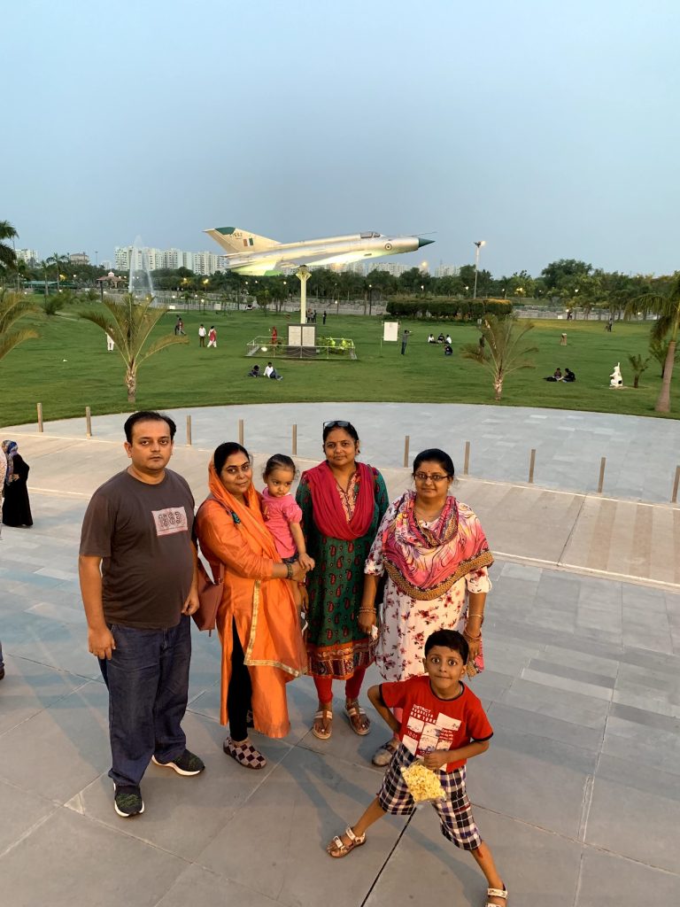 Goes away from the group when photo is taken, and stretch legs 